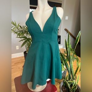 Emerald green deep V-neck mini dress. A-line, size M